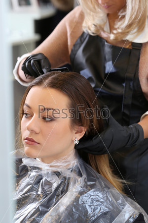Hairdresser salon. Woman during haircut