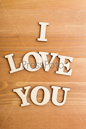 Wooden letters forming phrase I Love You