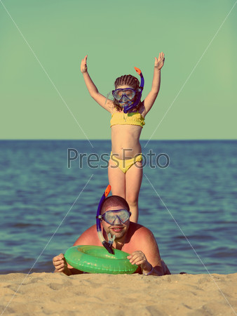 Father and daughter in scuba mask - vintage retro style