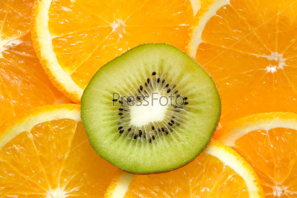 orange and kiwi on plate. be different.