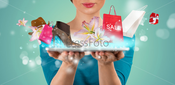 Unrecognizable woman shopping online using her tablet computer
