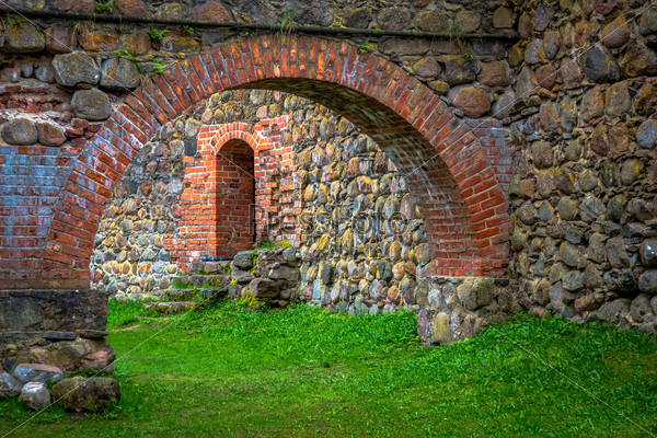 Stone arch and wall in internal courtyard