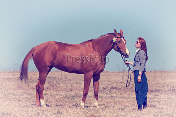 Beautiful red haired girl and Russian Don horse