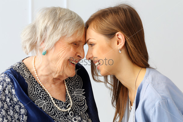Close-up. Elderly woman and beautiful granddaughter with wide smile