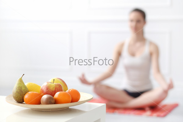 Lifestyle. Cute, attractive woman during yoga exercise