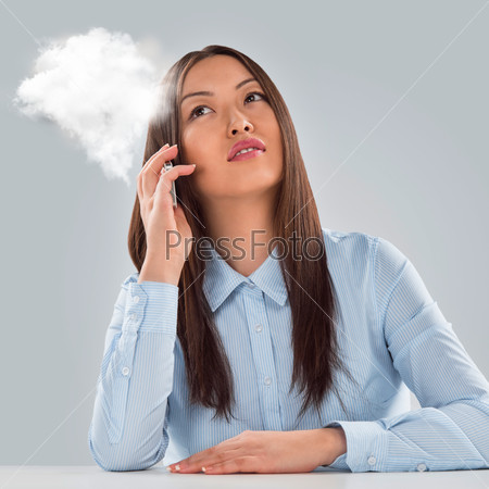 Business woman on hot line. Businesswoman calling phone and vapor appearing from it