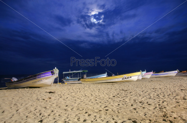 PANAMA, PEDASI - SEPT 17: Traditional boats of Panama that carry on people to the beautiful islands in sunset on Panama in Arenal beach, Herrera, Pedasi on September 17, 2013, stock photo