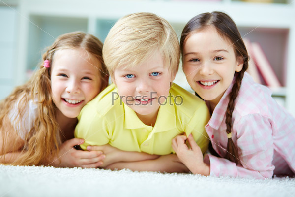 Three little friends looking at camera with smiles