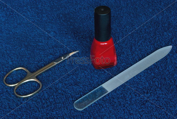 Composition of manicure set. Nail scissors and nail file.