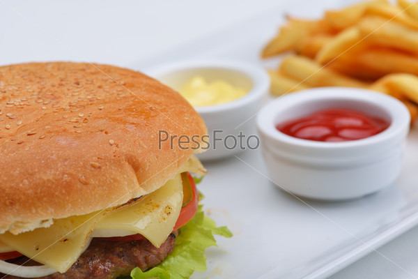 still life with fast food hamburger menu, french fries, soft\
drink and ketchup