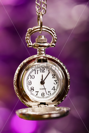 Quartz silver retro clock on a festive purple background