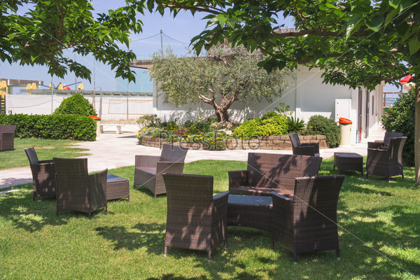 Garden furniture on lawn in courtyard a hotel spa