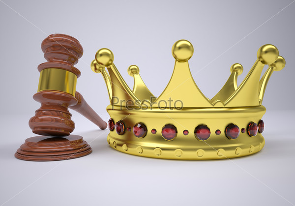 Gavel and gold crown. The gray background