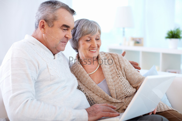 Senior couple surfing the net
