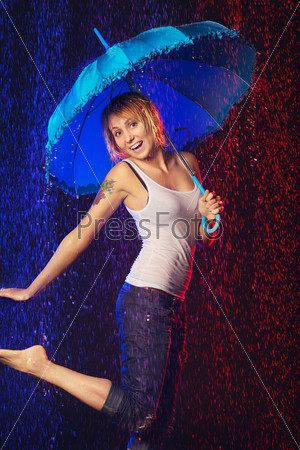 beautiful girl with umbrella under rain, black background