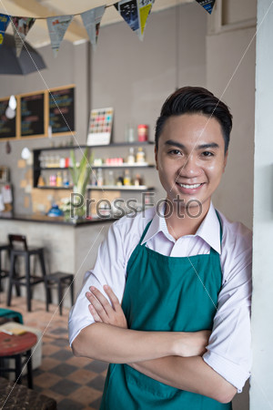 Portrait of cheerful cafe owner