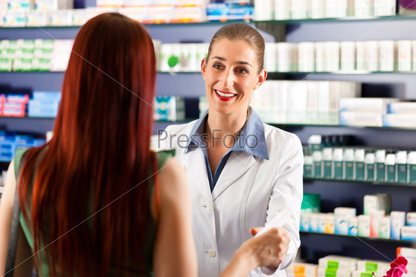Female pharmacist consulting a female customer in her pharmacy