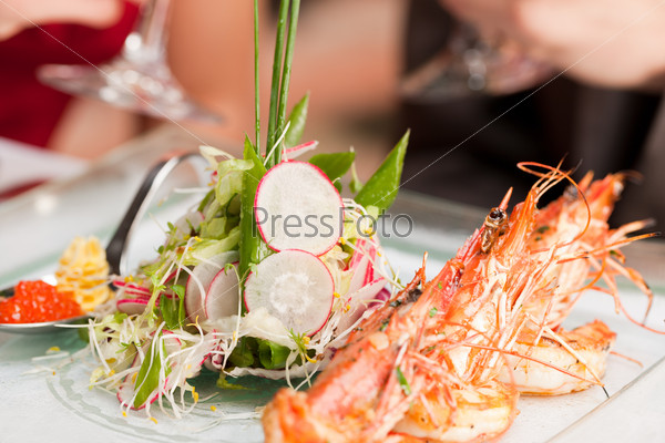 Close-up of fresh cooked shrimp on serving plate