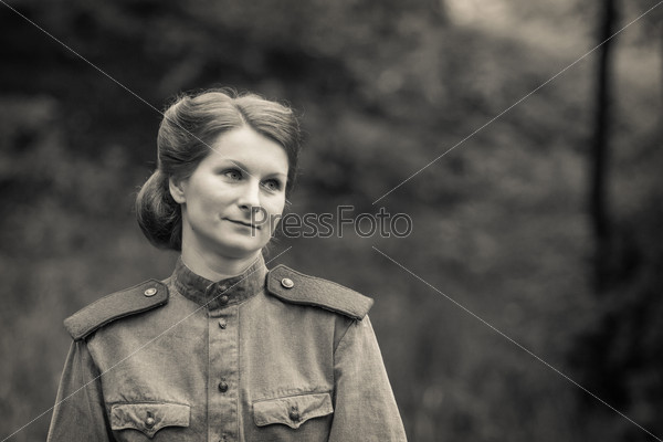 Young woman in Red Army form of 1943 year. Image with film grain effect.