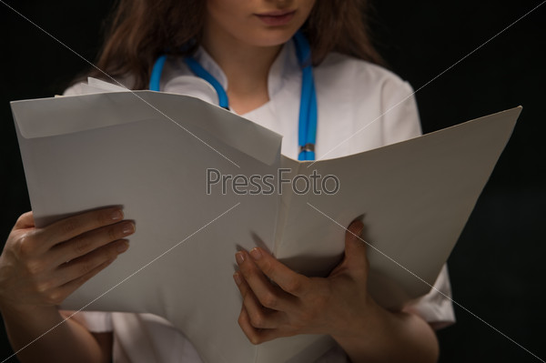 Doctor reading medical record
