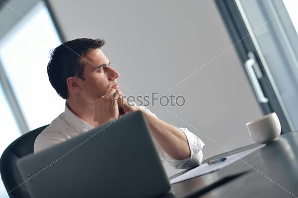 business man working on laptop computer at home