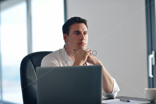 business man working on laptop computer at home