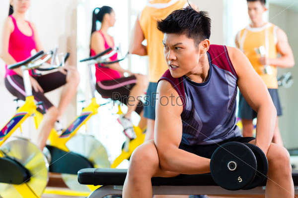 Asian people exercising sport for fitness in gym