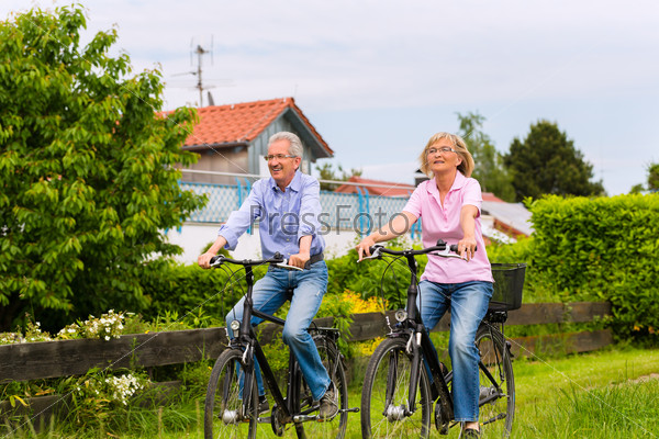 Seniors exercising with bicycle