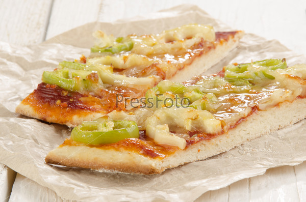 flat bread pizza with mild and hot paprika on kitchen paper