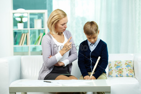 Portrait of annoyed tutor dissatisfied with pupil who is not ready for the lesson, stock photo