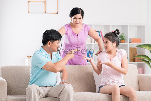 Father and daughter are fighting while mother is trying to calm them