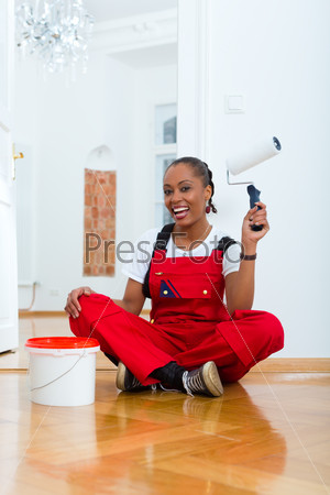 Young woman in overalls renovated because she moved to their new or old home