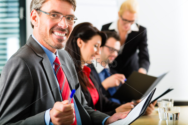 Business - businesspeople have a meeting with presentation in office, they negotiate a contract - Portrait of a businessman
