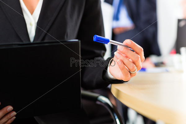 Business - businesspeople have a meeting with presentation in office, they negotiate a contract - closeup, stock photo