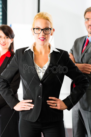 Business - group of successful and confident businesspeople being a team and showing it
