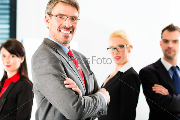 Business - group of successful and confident businesspeople being a team and showing it