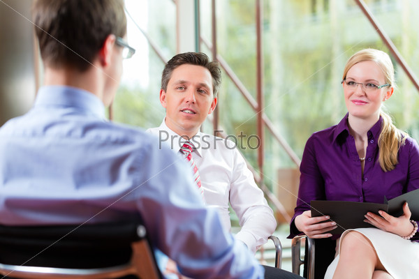 Man having an interview with manager and partner employment job candidate hiring resume CEO work business