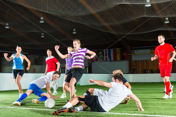 Team playing football or soccer sport indoor