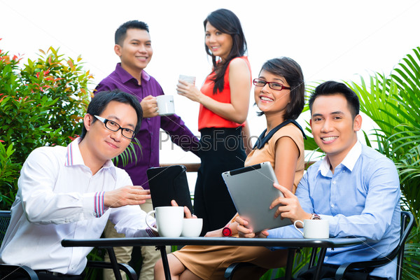 Asian Creative team - young businesspeople are successful with a project