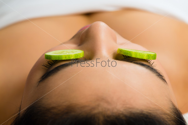 Young Asian Woman in a beauty spa getting a treatment for facial Skin Care