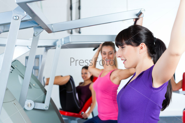 Happy, young women doing strength or sports training in gym for a better fitness