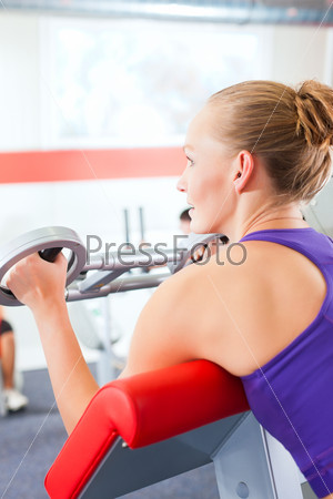 Happy, young women doing strength or sports training in gym for a better fitness