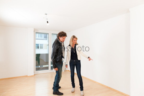 Real estate market - young couple looking for real estate to rent or buy an apartment