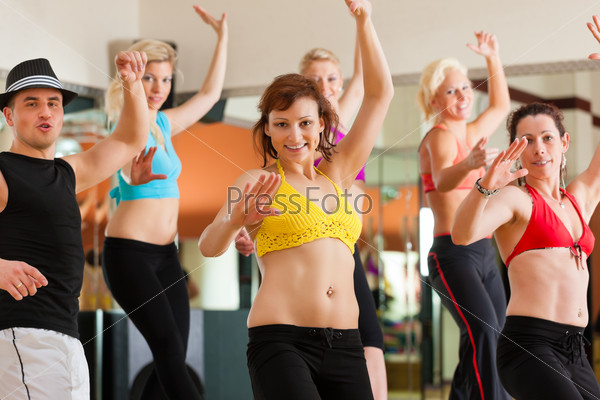 Jazzdance - young people dancing in a studio or gym doing sports or practicing a dance number