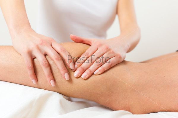 Patient at the physiotherapy gets massage or lymphatic drainage