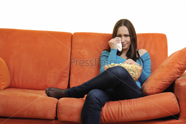 young woman eat popcorn and watching tv