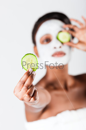 Beautiful African woman in Studio with facial mask