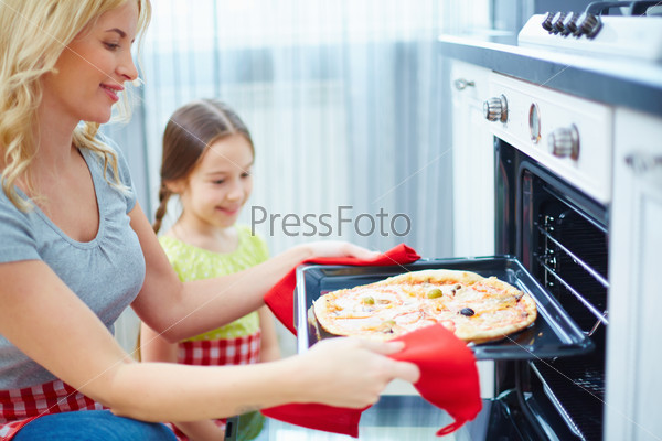 Mother and daughter cooking