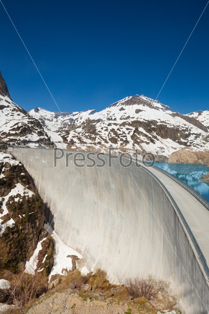 Very high made of concrete Emosson hydroelectric dam near village of Chatelard, Swiss on the border with France
