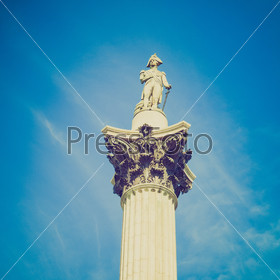 Vintage looking Nelson Column monument in Trafalgar Square London UK